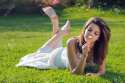 19672806-Pretty-young-girl-with-a-daisy-in-hand-lying-on-grass-with-bare-feet-Purity-and-relax-conceptual-Stock-Photo (1).jpg