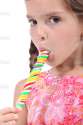 depositphotos_13993689-Little-girl-licking-a-lollipop.jpg