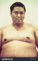 stock-photo-fat-naked-upper-body-and-belly-stomach-of-an-asian-african-man-showing-proud-expression-on-his-face-289702625.jpg