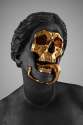 gold skull face statue.jpg