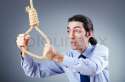2849849-businessman-committing-suicide-through-hanging.jpg