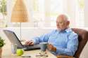 8748717-elderly-man-using-laptop-computer-in-his-study-at-home-having-coffee-looking-at-screen.jpg