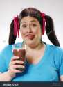 stock-photo-one-fat-girl-holding-a-chocolate-glass-dirty-chocolate-mouth-38714338.jpg