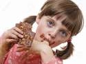 28368480-little-girl-eating-a-chocolate-Stock-Photo.jpg