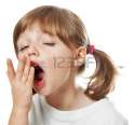 18278934-a-tired-little-girl-yawning.jpg