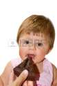 14712126-sweet-little-girl-eating-a-slice-of-chocolate-tarte.jpg