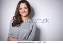 stock-photo-portrait-of-an-attractive-fashionable-young-brunette-woman-254977969.jpg