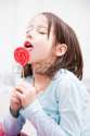 37040381-little-girl-enjoying-the-sugar-lollipop.jpg