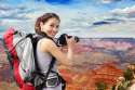 29168876-Young-woman-with-backpack-taking-a-photo-in-grand-canyon-asian-Stock-Photo.jpg