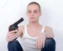 27922770-Suicide-Depressed-young-man-holding-gun-near-his-head-Stock-Photo.jpg
