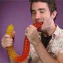 happy man eating big worm.jpg