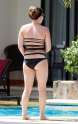 hilary_duff_poolside_swimsuit_candids_in_mexico_july_31_03.jpg