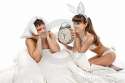 close-up-couple-lying-bed-woman-rabbit-holds-alarm-clock-near-ear-man-30148986.jpg