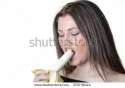 stock-photo-cute-brunette-lady-wear-black-shirt-holding-and-eating-a-peeled-banana-379738414.jpg