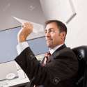 6582852-Businessman-throwing-paper-airplane-Stock-Photo.jpg
