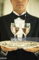 AB17738-waiter-carrying-two-glasses-of-wine-on-tray-gettyimages[1].jpg