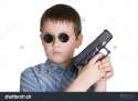 stock-photo-a-portrait-of-a-young-boy-holding-a-handgun-on-a-white-background-depth-of-field-with-focus-on-gun-19724440.jpg