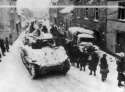 3rd_Armored_Division_M4A3E2_Sherman_Jumbo_Tank_and_83rd_Infantry_in_Lierneux_Belgium_1945.jpg