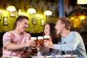 9997043-Young-people-with-a-beer-in-a-restaurant-Stock-Photo.jpg