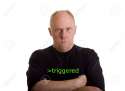 3831633-An-older-bald-man-in-a-black-shirt-looking-angry-or-mad-Stock-Photo.jpg