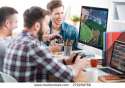 stock-photo-testing-new-game-three-young-men-playing-computer-games-while-sitting-at-the-desk-in-the-office-279289766.jpg