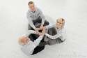 three-businesspeople-meditating-floor-18489817.jpg
