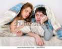 stock-photo-young-couple-laying-in-bed-together-99629018.jpg