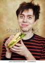 stock-photo-the-happy-young-man-with-a-big-hamburger-133598537.jpg