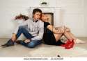 stock-photo-man-in-love-and-the-woman-sit-on-a-floor-before-a-fireplace-243106390.jpg