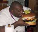 fat-guy-eating-giant-hamburger1.jpg