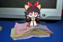 1girl _3 animal_ears bow brown_eyes cat_ears chibi detached_sleeves female hair_bow japanese_clothes miko money paper_child papercraft photo solo touhou-332dba0e513e48bb321acc59d0b39d02.jpg