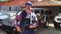 El Chapo Guzmán vested and weilding assualt rifle.jpg