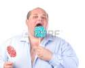 15210995-fat-man-in-a-blue-shirt-eating-a-lollipop-isolated.jpg