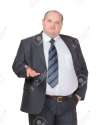 17542353-Obese-businessman-in-a-suit-and-tie-standing-facing-the-camera-making-a-point-with-one-hand-in-his-p-Stock-Photo.jpg