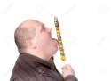 15869769-Fat-obese-man-enjoying-a-a-long-colourful-striped-lollipop-standing-licking-it-with-a-look-of-comple-Stock-Photo.jpg