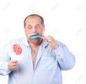 15210861-Fat-Man-in-a-Blue-Shirt-Eating-a-Lollipop-isolated-Stock-Photo.jpg