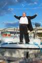 19340392-Overweight-man-in-tuxedo-standing-on-the-deck-of-a-luxury-pleasure-boat-Stock-Photo.jpg