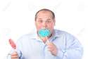 15211157-Fat-Man-in-a-Blue-Shirt-Eating-a-Lollipop-isolated-Stock-Photo.jpg