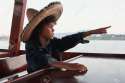 21032508-Handsome-boy-with-Mexican-hat-is-pointing-something-in-the-sea-Stock-Photo.jpg