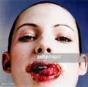 BD4717-001-young-woman-with-chocolate-round-mouth-gettyimages.jpg
