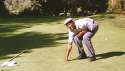 ENTERTAINMENT-michael-jordan-gets-pulled-down-golf-hole.gif