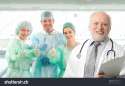 stock-photo-surgeon-team-lead-by-senior-white-haired-doctor-looking-at-camera-smiling-90999317.jpg