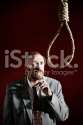stock-photo-14166336-depressed-man-stares-at-noose-contemplating-suicide.jpg