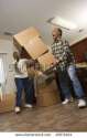 stock-photo-senior-african-american-man-dropping-stacked-moving-boxes-while-his-wife-attempts-to-catch-them-45071824.jpg