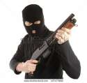 stock-photo-masked-man-aims-with-rifle-127477988.jpg