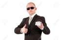 5942012-a-young-business-man-with-sunglasses-showing-a-business-card-with-copy-space-and-posing-with-the-thu-Stock-Photo.jpg