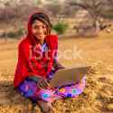 stock-photo-91828535-happy-gypsy-indian-young-girl-using-laptop-india.jpg