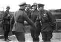 German Offizier shakes hand with Soviet officer.png