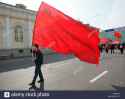 a-young-man-carries-the-red-banner-during-the-pro-communist-demonstration-FFDEGA.jpg