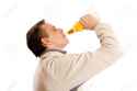 17477986-Man-drinking-beer-from-a-glass-bottle-on-a-white-background-Stock-Photo.jpg